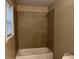 Clean bathroom with tile shower and bathtub at 1405 Bentley Woods Trl, Lithonia, GA 30058