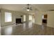 Living room with vaulted ceiling, fireplace, and wood-look floors at 40 Autumn Ct, Covington, GA 30016