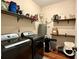 Functional laundry room, washer, dryer, and shelving at 375 Campground Rd, Waco, GA 30182