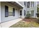 Gray exterior of condo building with stone pathway, entrance and landscaping at 1606 Vicksburg Pl, Atlanta, GA 30350