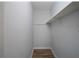 Small closet with a shelf and hanging rod at 4370 Raven Valley Ct, Decatur, GA 30035