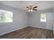 Well-lit bedroom with hardwood floors, ceiling fan and neutral walls at 4370 Raven Valley Ct, Decatur, GA 30035