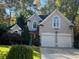Two story house with double garage and landscaped yard at 2698 Claredon Nw Trce, Kennesaw, GA 30144