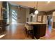 Open kitchen with island, granite countertops, and hardwood floors at 2698 Claredon Nw Trce, Kennesaw, GA 30144
