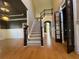 Two-story foyer with hardwood floors and staircase at 2698 Claredon Nw Trce, Kennesaw, GA 30144