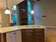 Open kitchen with island, granite countertops, and stone fireplace at 2698 Claredon Nw Trce, Kennesaw, GA 30144