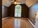 Spacious bedroom with hardwood floors and large window at 2698 Claredon Nw Trce, Kennesaw, GA 30144