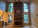 Great room features a stone fireplace and wall-to-wall windows at 2698 Claredon Nw Trce, Kennesaw, GA 30144