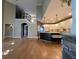 Two-story living room with hardwood floors and kitchen views at 2698 Claredon Nw Trce, Kennesaw, GA 30144