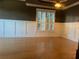 Formal dining room with wainscoting and hardwood floors at 2698 Claredon Nw Trce, Kennesaw, GA 30144
