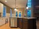 Open kitchen with island, granite countertops, and stainless steel appliances at 2698 Claredon Nw Trce, Kennesaw, GA 30144