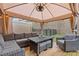 Relaxing covered patio with wicker furniture at 3333 Castleberry Village Cir, Cumming, GA 30040