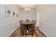 Charming dining room with wood table and chairs, and decorative wall art at 3333 Castleberry Village Cir, Cumming, GA 30040