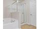 Bathroom with bathtub and separate shower stall at 3333 Castleberry Village Cir, Cumming, GA 30040