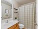 Clean bathroom with shower/tub combo and wood vanity at 3333 Castleberry Village Cir, Cumming, GA 30040