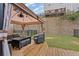 Covered patio with wicker furniture and small lawn at 3333 Castleberry Village Cir, Cumming, GA 30040