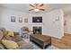 Relaxing living room with fireplace, ceiling fan and hardwood floors at 3333 Castleberry Village Cir, Cumming, GA 30040