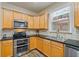 Modern kitchen with stainless steel appliances and an island at 3333 Castleberry Village Cir, Cumming, GA 30040