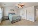 Bright bedroom with ensuite bathroom and ceiling fan at 3333 Castleberry Village Cir, Cumming, GA 30040