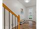 Bright foyer with hardwood floors, bench and staircase at 3333 Castleberry Village Cir, Cumming, GA 30040