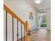 Inviting entryway with wood-look floors, bench, and access to the backyard at 3333 Castleberry Village Cir, Cumming, GA 30040