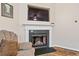 Modern fireplace with built-in shelving and a large TV at 3333 Castleberry Village Cir, Cumming, GA 30040