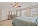 Well-lit bedroom featuring a large bed and ample closet space at 3333 Castleberry Village Cir, Cumming, GA 30040