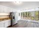 Kitchen with sunroom and stainless steel refrigerator at 4716 Balley Shannon Se Dr, Mableton, GA 30126