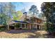 Brick home with a carport and a large, wooded lot at 2537 Foster Ridge Ne Ct, Atlanta, GA 30345