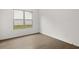 Well-lit bedroom with hardwood floors and backyard view at 3719 Tielman St, Snellville, GA 30078