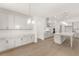 Open concept kitchen featuring white cabinets, quartz countertops and an island at 3719 Tielman St, Snellville, GA 30078