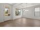 Spacious dining area with hardwood floors, chandelier, and access to the front entrance at 3719 Tielman St, Snellville, GA 30078