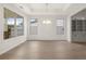Formal dining room with hardwood floors, chandelier, and large windows at 3719 Tielman St, Snellville, GA 30078
