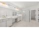 Elegant bathroom featuring double vanity and a large walk-in shower at 3719 Tielman St, Snellville, GA 30078