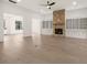 Open living room featuring hardwood floors, a fireplace and built-in shelving at 3719 Tielman St, Snellville, GA 30078