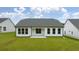 Charming house with white siding, gray roof, and a patio at 3719 Tielman St, Snellville, GA 30078