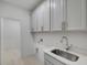 Laundry room with cabinets and a utility sink at 3719 Tielman St, Snellville, GA 30078