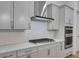 Modern kitchen with gray cabinets, white backsplash and stainless steel appliances at 3719 Tielman St, Snellville, GA 30078
