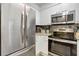 Modern kitchen with stainless steel appliances and granite countertops at 2870 Pharr Court South # 503, Atlanta, GA 30305