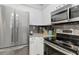 Modern kitchen with stainless steel appliances and granite countertops at 2870 Pharr Court South # 503, Atlanta, GA 30305