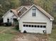 Ranch home with beige siding, stone accents, and a two-car garage at 2520 Conley Dr, Cumming, GA 30040