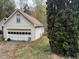 Single car garage with white door, needs landscaping at 2520 Conley Dr, Cumming, GA 30040