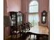 Formal dining room with large table, hutch, and large window at 2520 Conley Dr, Cumming, GA 30040