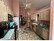Kitchen with wood cabinets, vinyl flooring, and stainless steel appliances at 2520 Conley Dr, Cumming, GA 30040