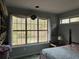 Serene bedroom with large windows and views of nature at 2520 Conley Dr, Cumming, GA 30040