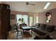 Spacious living room featuring hardwood floors, a large window, and a cozy seating area at 2520 Conley Dr, Cumming, GA 30040