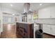 Granite island kitchen with stainless steel appliances at 1686 Alvarado Sw Ter, Atlanta, GA 30310