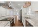 Bright kitchen with white cabinets, granite counters, and stainless steel appliances at 1686 Alvarado Sw Ter, Atlanta, GA 30310