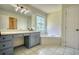 Bathroom featuring a garden tub and stained-glass window at 3030 Habersham Cir, Covington, GA 30014