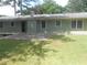 Back exterior view showing patio and yard at 3536 Redwine Ct, Atlanta, GA 30344